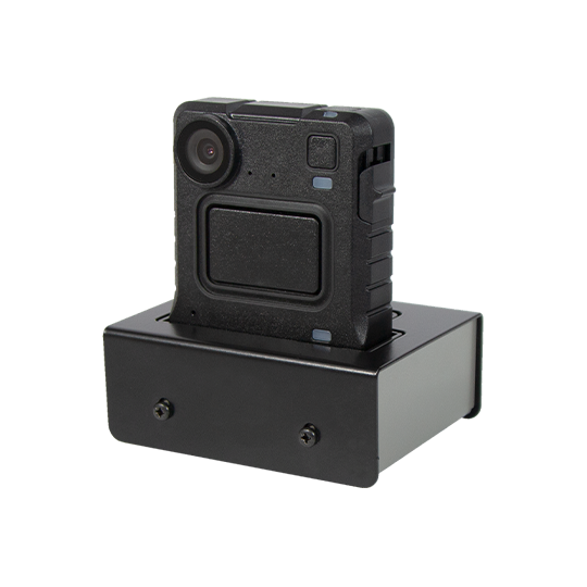 Black wearable camera on charging dock.