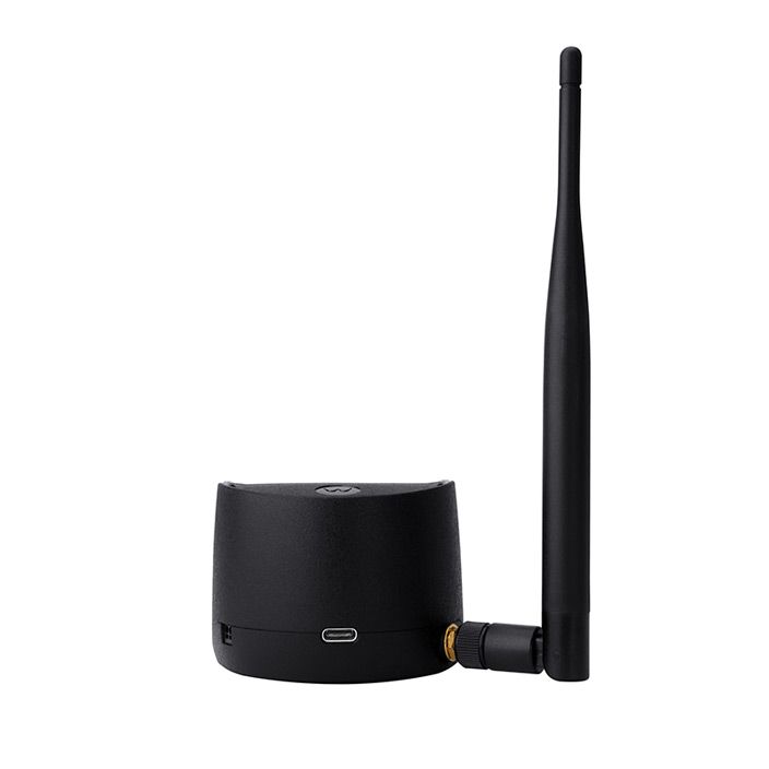 Black wireless adapter with detachable antenna and USB port.