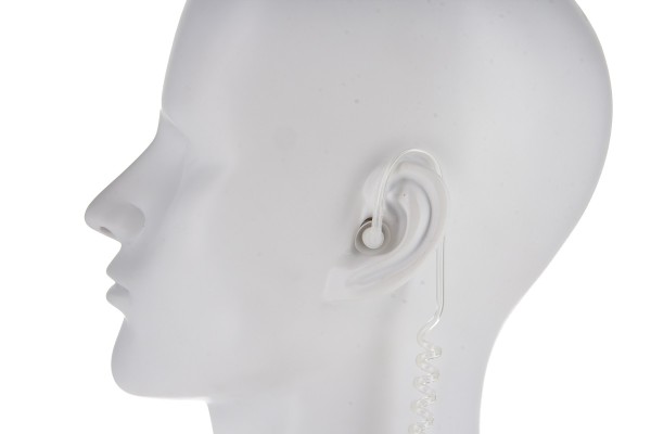 7000_00754204_COP_02.jpg White mannequin with earpiece and coiled cable in left ear.