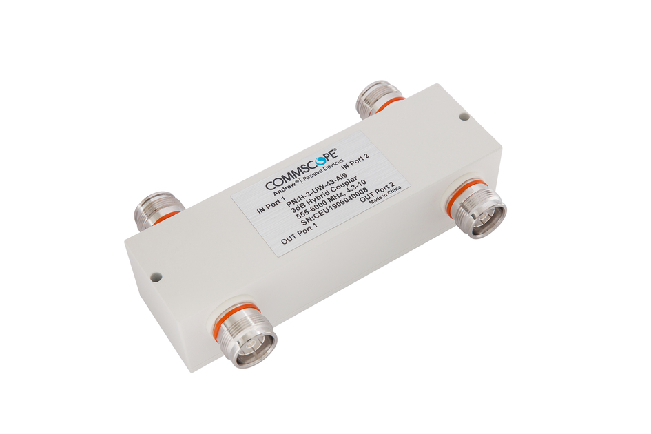 Rectangular device with four connectors and a label with technical information.