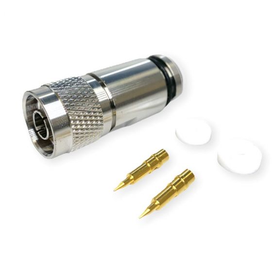 Koaxial-Steckverbinder mit zwei goldenen Kontakten und zwei weißen Scheiben.