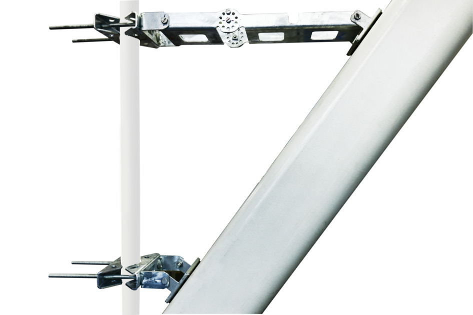 Silver metal part connects two white round pipes at a right angle.