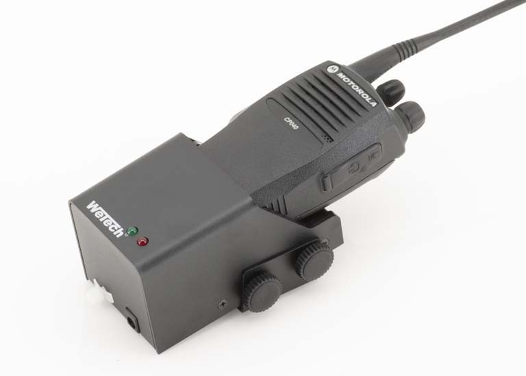 Radio on charging station with control lights.