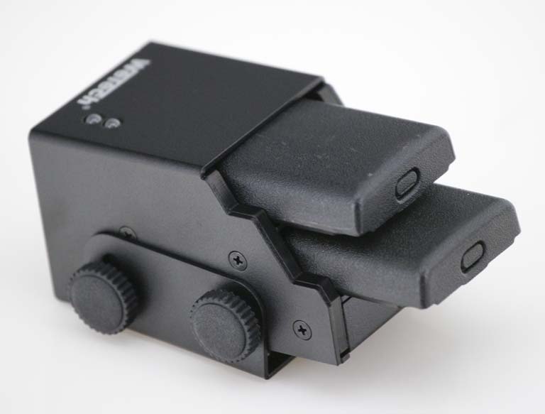 Black electronic device with two protruding rectangular connectors.