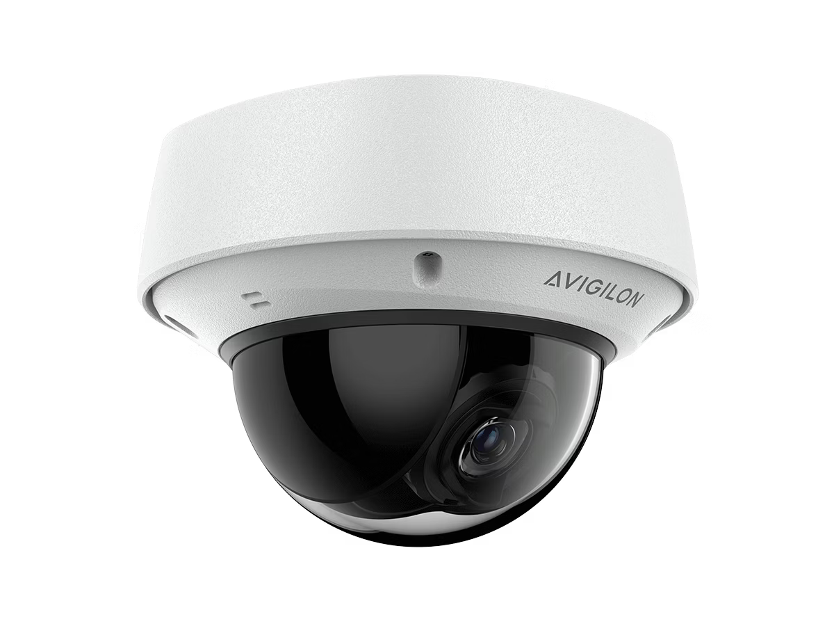 Dome surveillance camera with white casing and black lens.