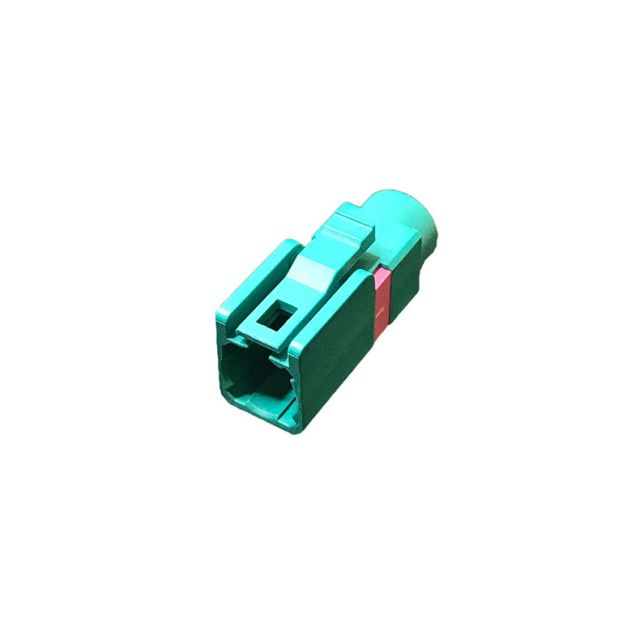 7000-00694400_vim_01.jpg Green rectangular plastic connector with red stripe.