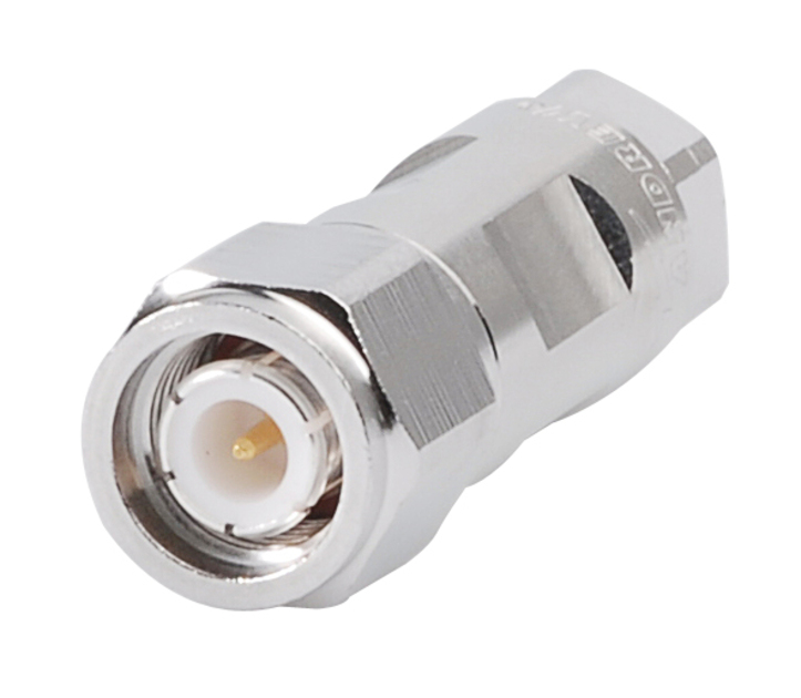 7000-00752918_com_01.jpg Metal connector with a threaded design and central pin.
