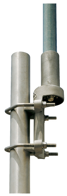 Metal clamp attaches two vertical pipes.