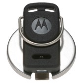 Black key fob with silver ring clip on metal plate. Logo visible.