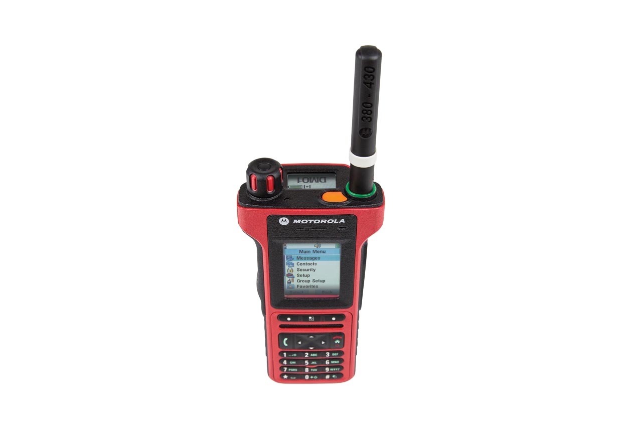Red Motorola handheld radio with antenna and display showing menu options.