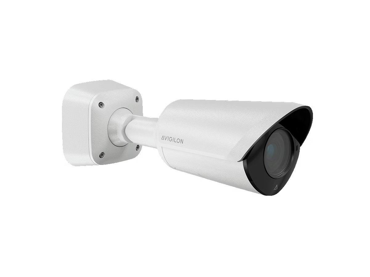 White surveillance camera on a wall mount, side view.