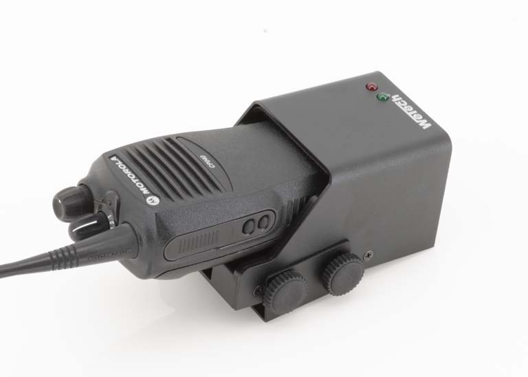 Handheld radio in charging dock with LED indicators