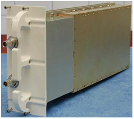 Metal device with white connectors on a blue surface.