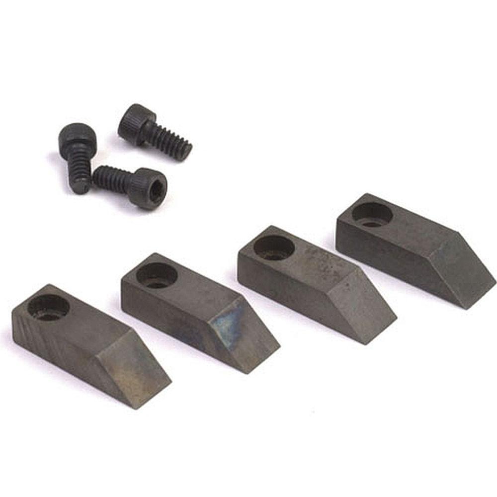 Four black metal wedges with holes and three screws on white background.