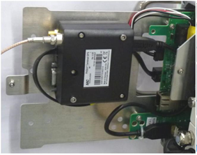 Electronic device with cables mounted on a metal plate.