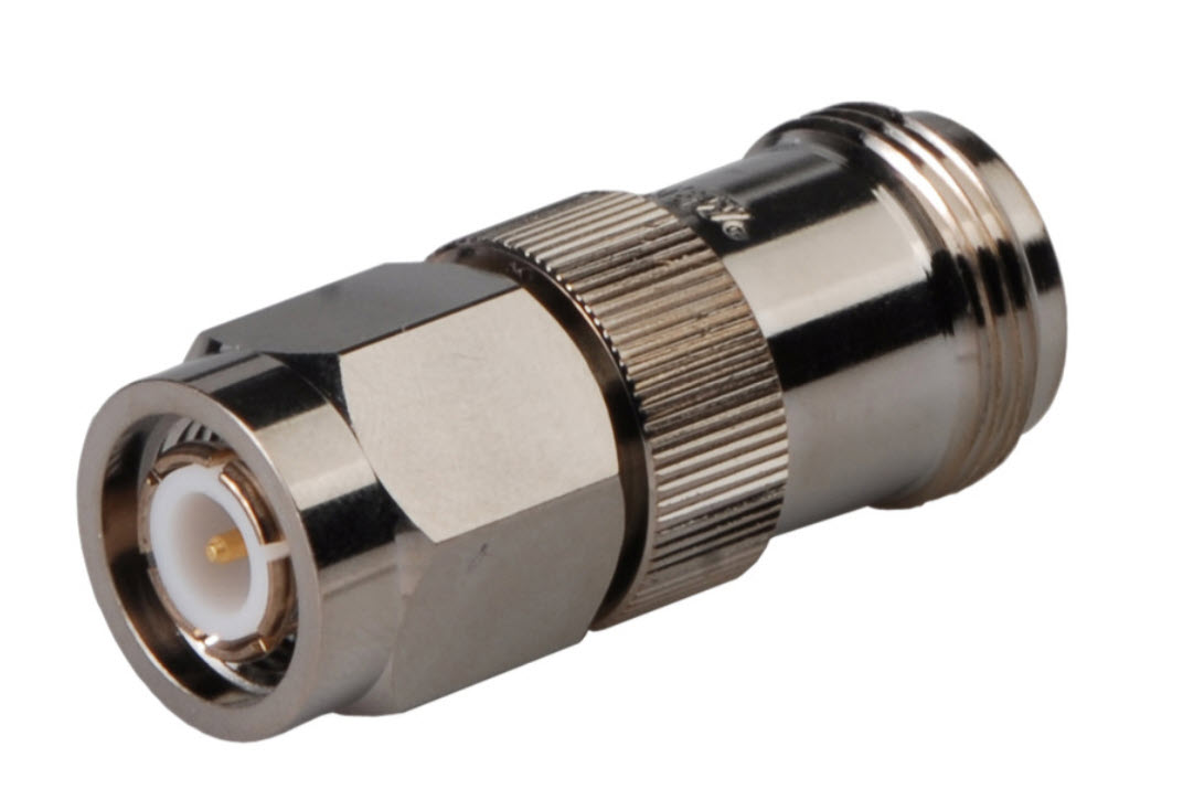 Silver RF connector with threaded, cylindrical shape.