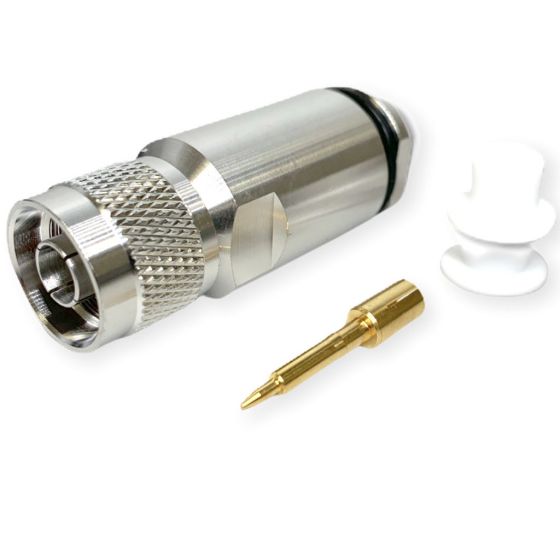 Metallstecker mit goldener Spitze und weißen Kunststoffteilen.