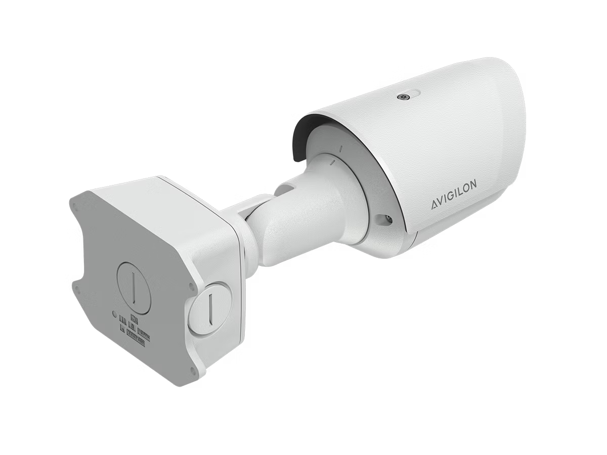 White cylindrical surveillance camera with wall mount.