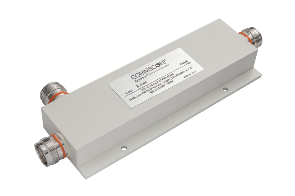 White electronic component with four connectors and inscription on metal plate.