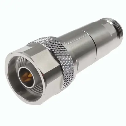 Metal coaxial connector with threaded attachment and knurled surface.