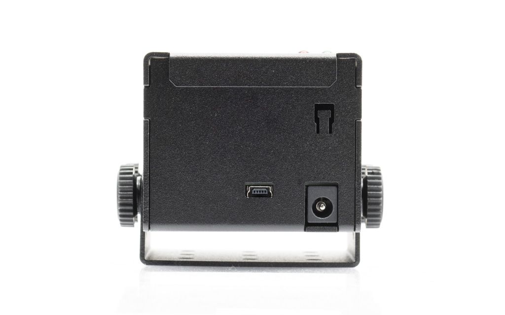 Back of a black electronic device with USB and power port.