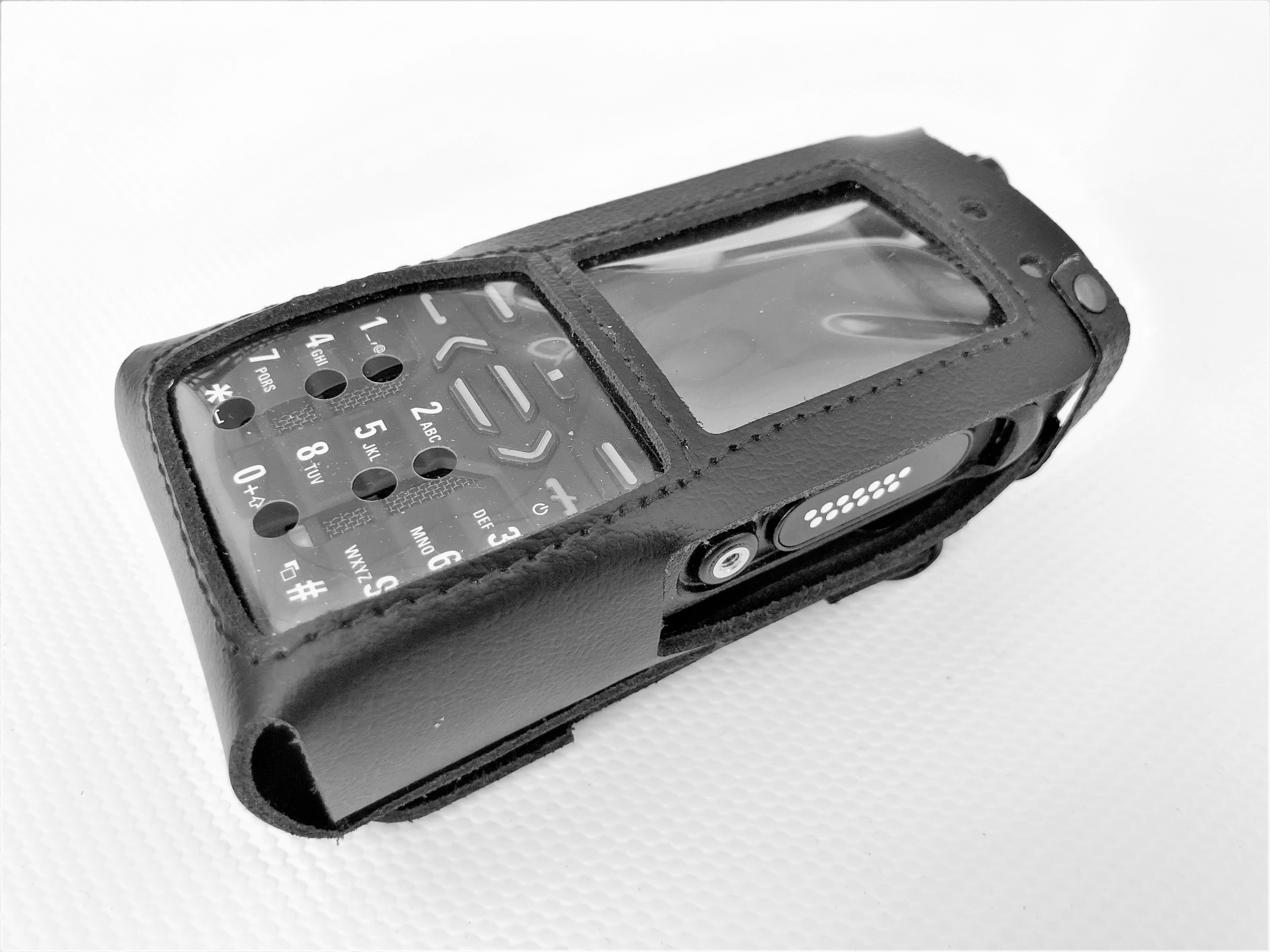 Mobile keypad phone in black leather case with display cover.