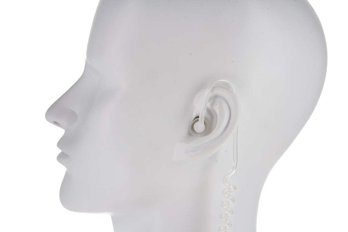 White mannequin head with clear acoustic tube in the ear.