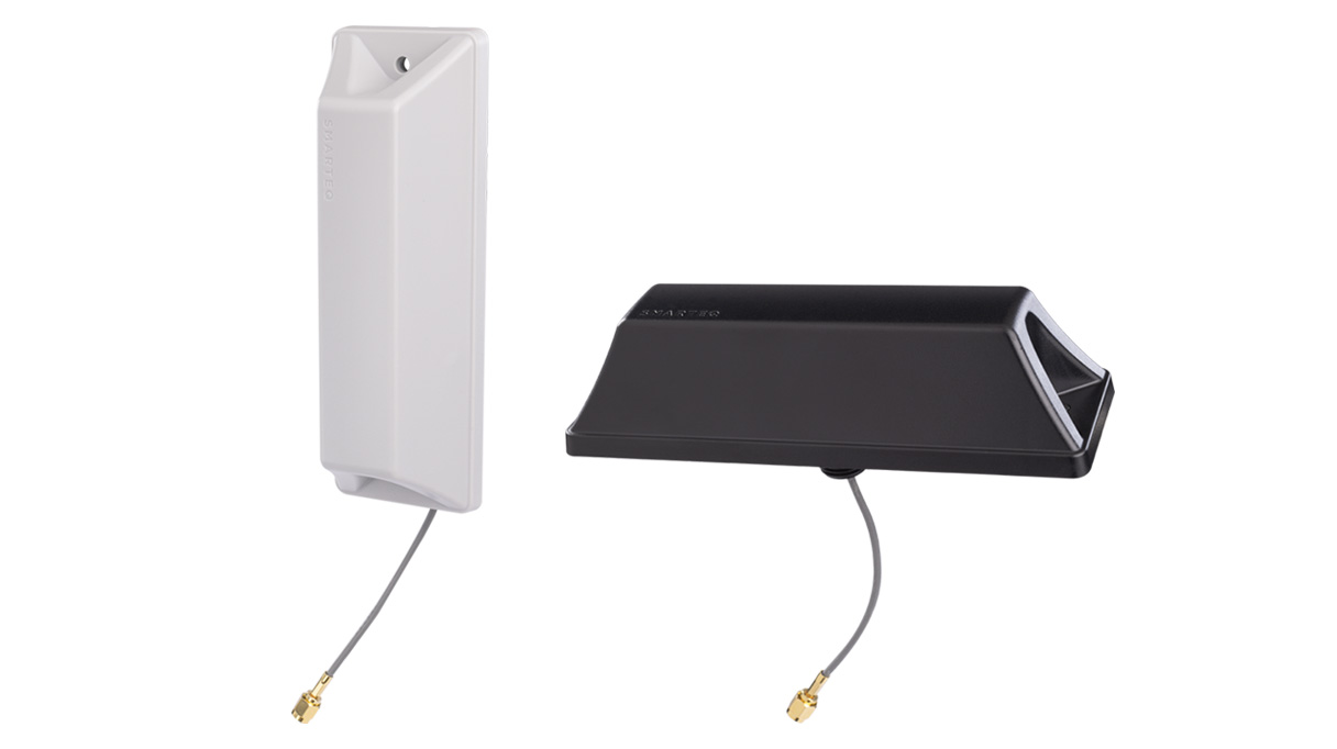 Two antennas with cable and connector, one white, one black.