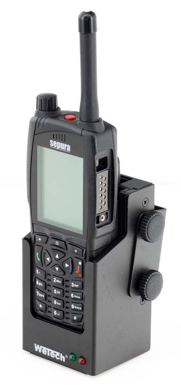 A radio device in a vertical charging dock.