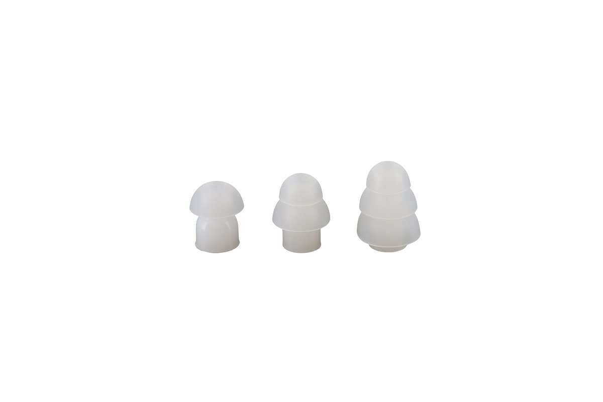 Three white translucent silicone plugs in mushroom shape with different stackings.