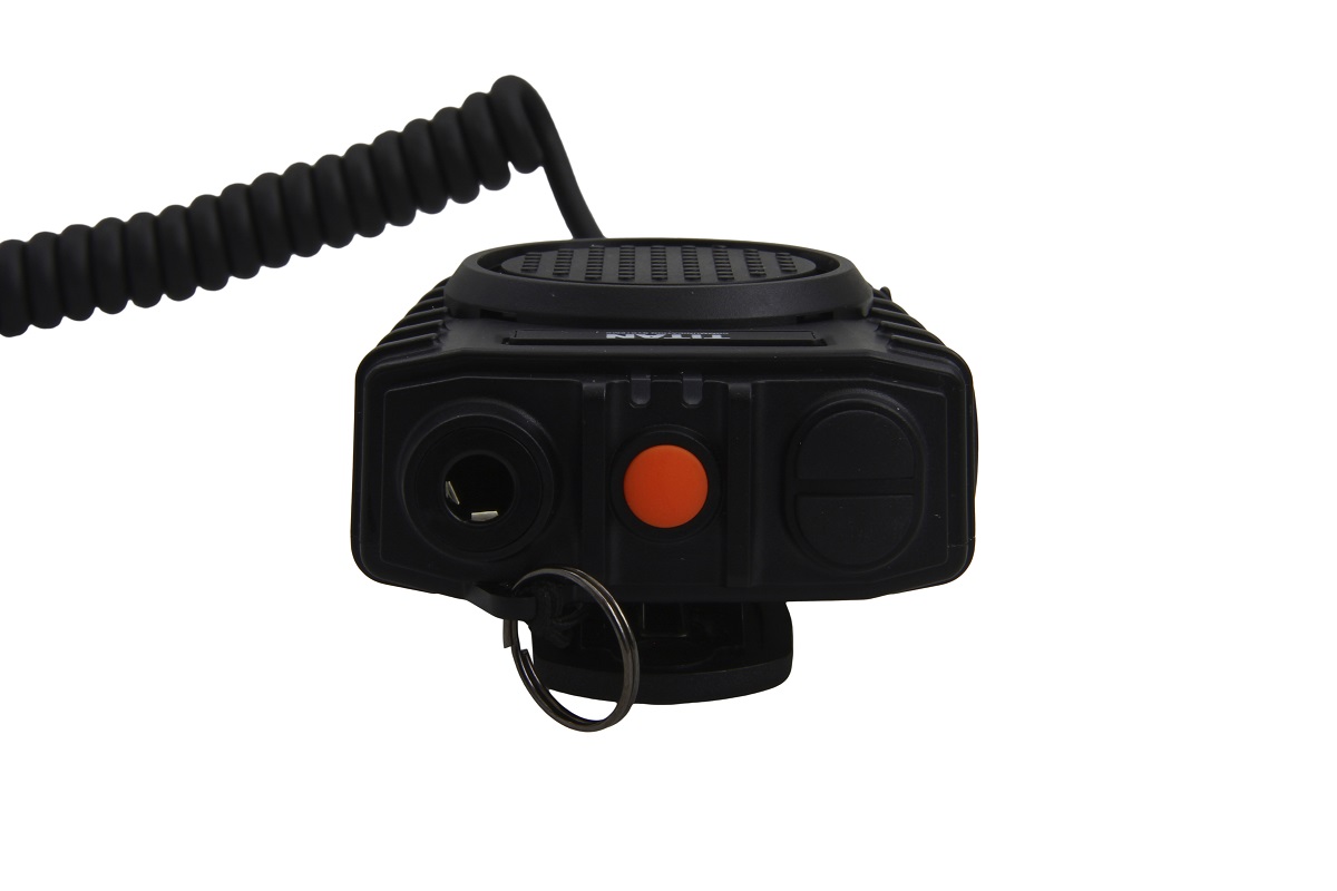 Front of a black radio with orange button
