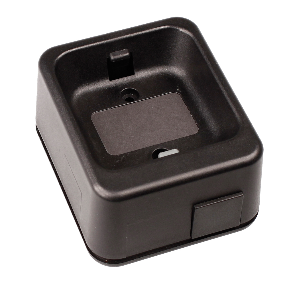 6507-012-000-51.jpg Black plastic mount with rectangular opening and mounting holes.