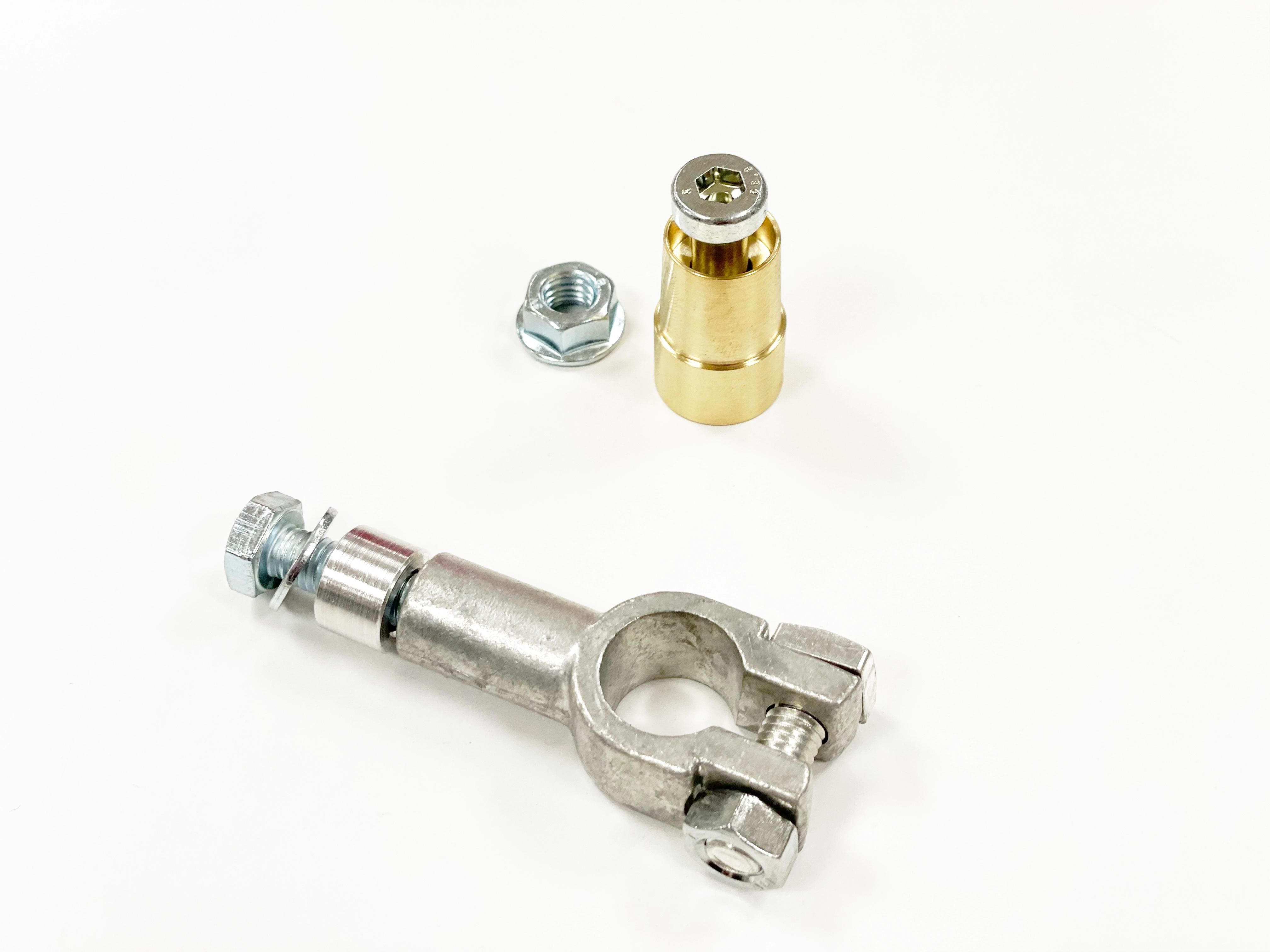 A clamp connector, a screw, and a gold socket on a white background.