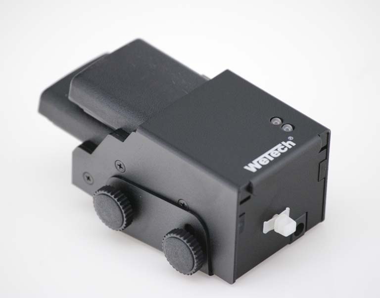 Black technical device with two knobs on the side.