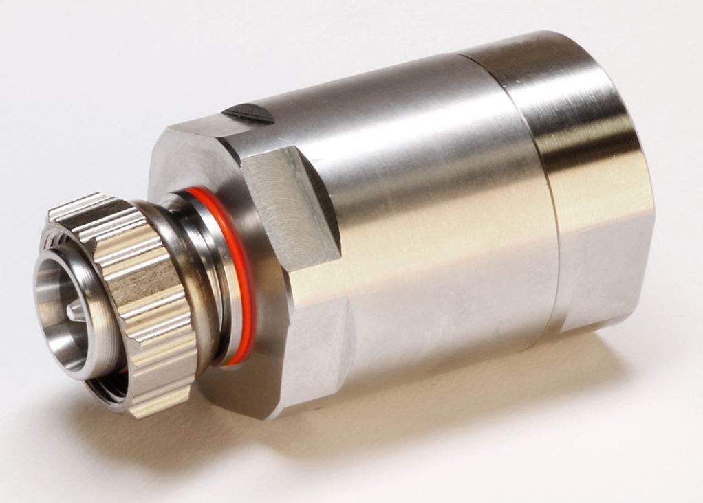 Metal quick connector with red sealing ring in close-up.