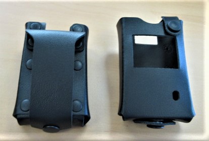 Two black leather cases, one with belt loop, the other with window.