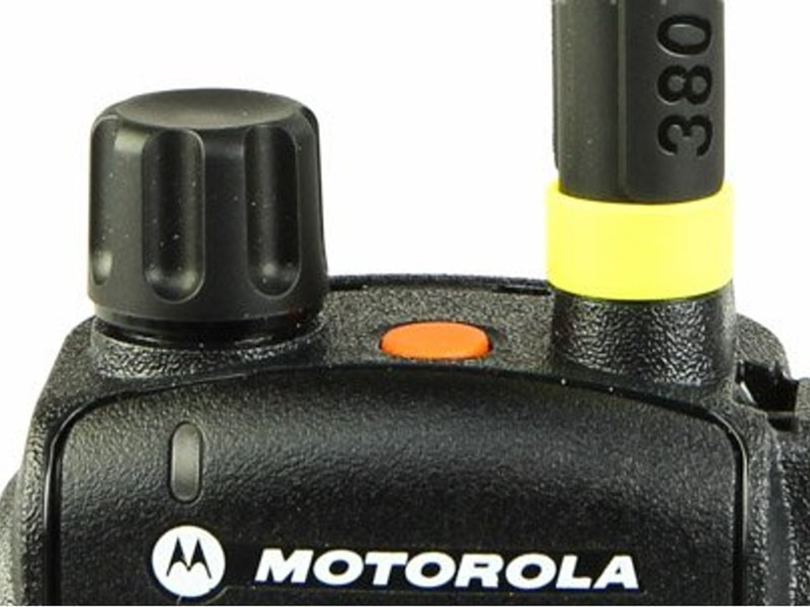 Close-up of a radio device with knob, antenna, and logo.