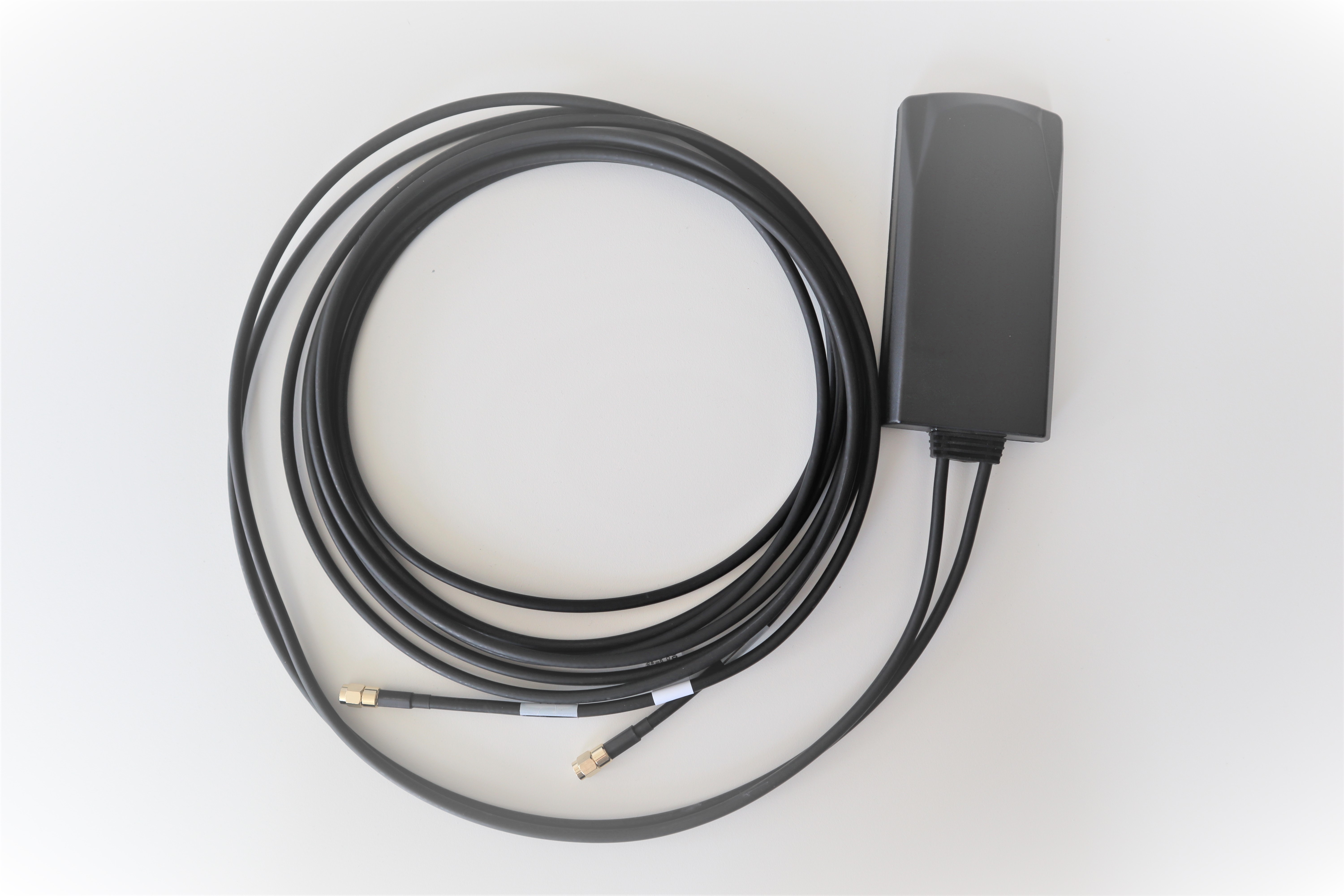 Black antenna with long cable and two connectors.
