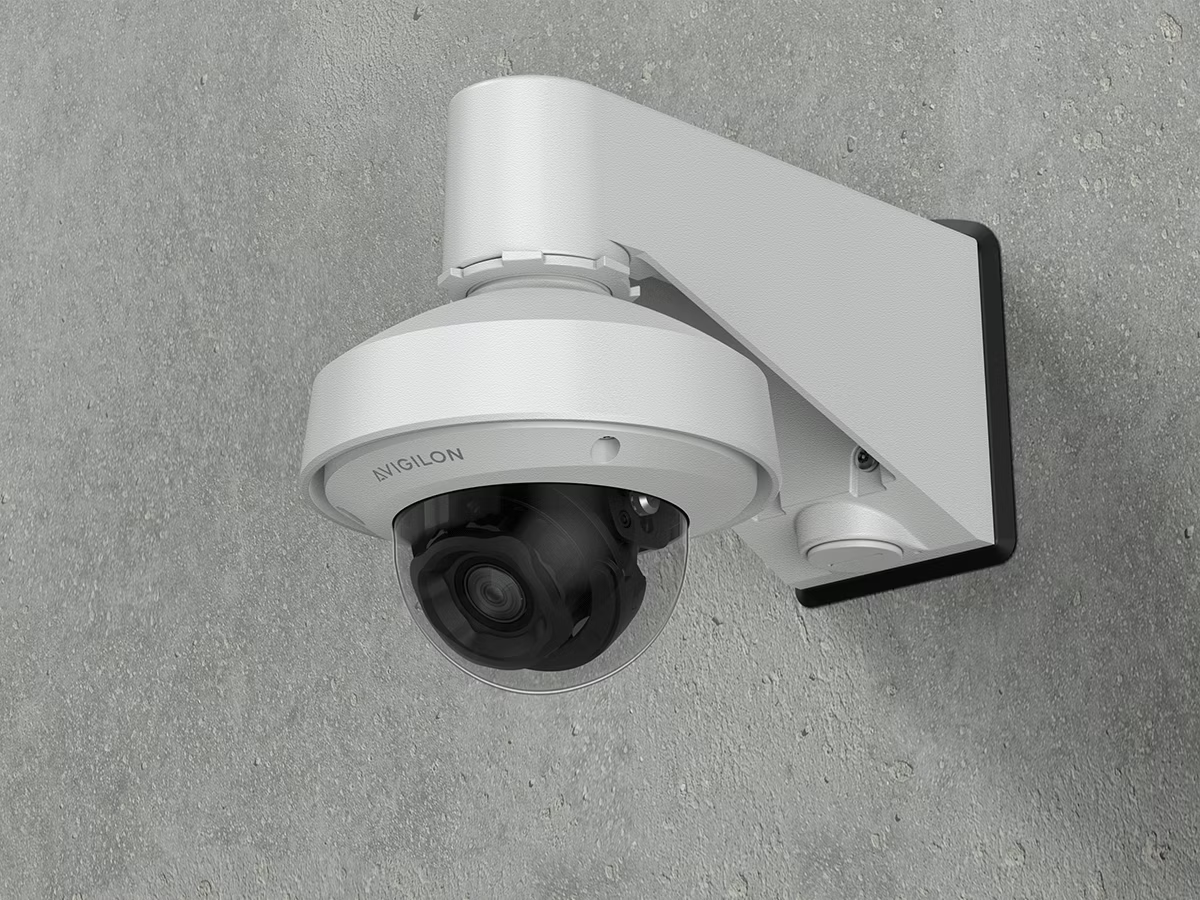 Surveillance camera mounted on a wall.