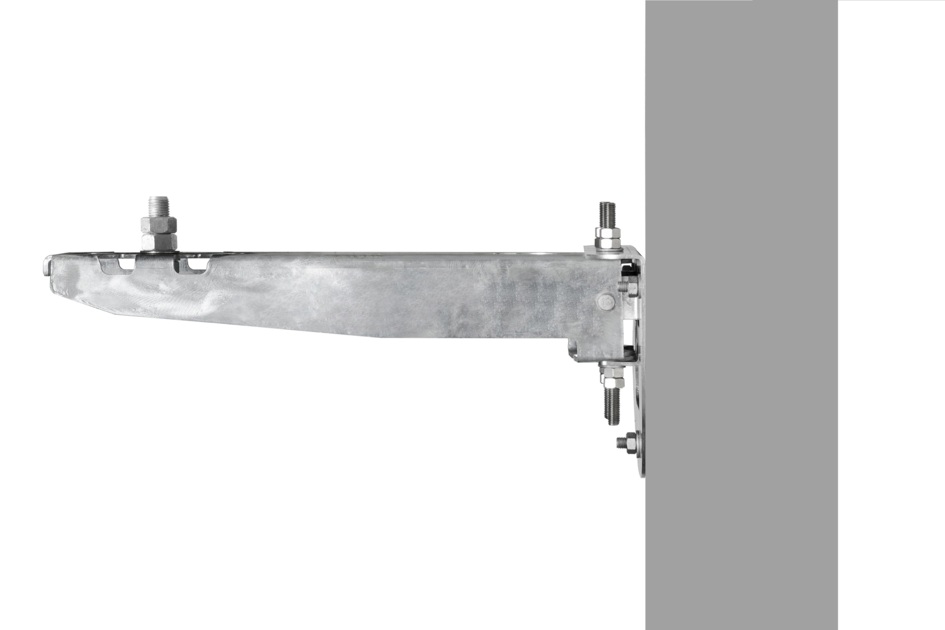 Metal bracket with screws mounted on the wall.