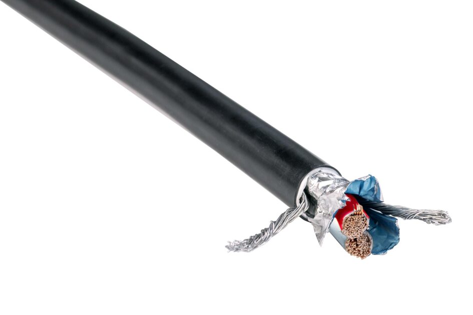 Close-up of an open coaxial cable with copper wires and shielding.