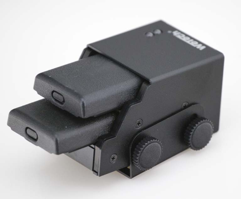 Black electronic device with two slots and dials.