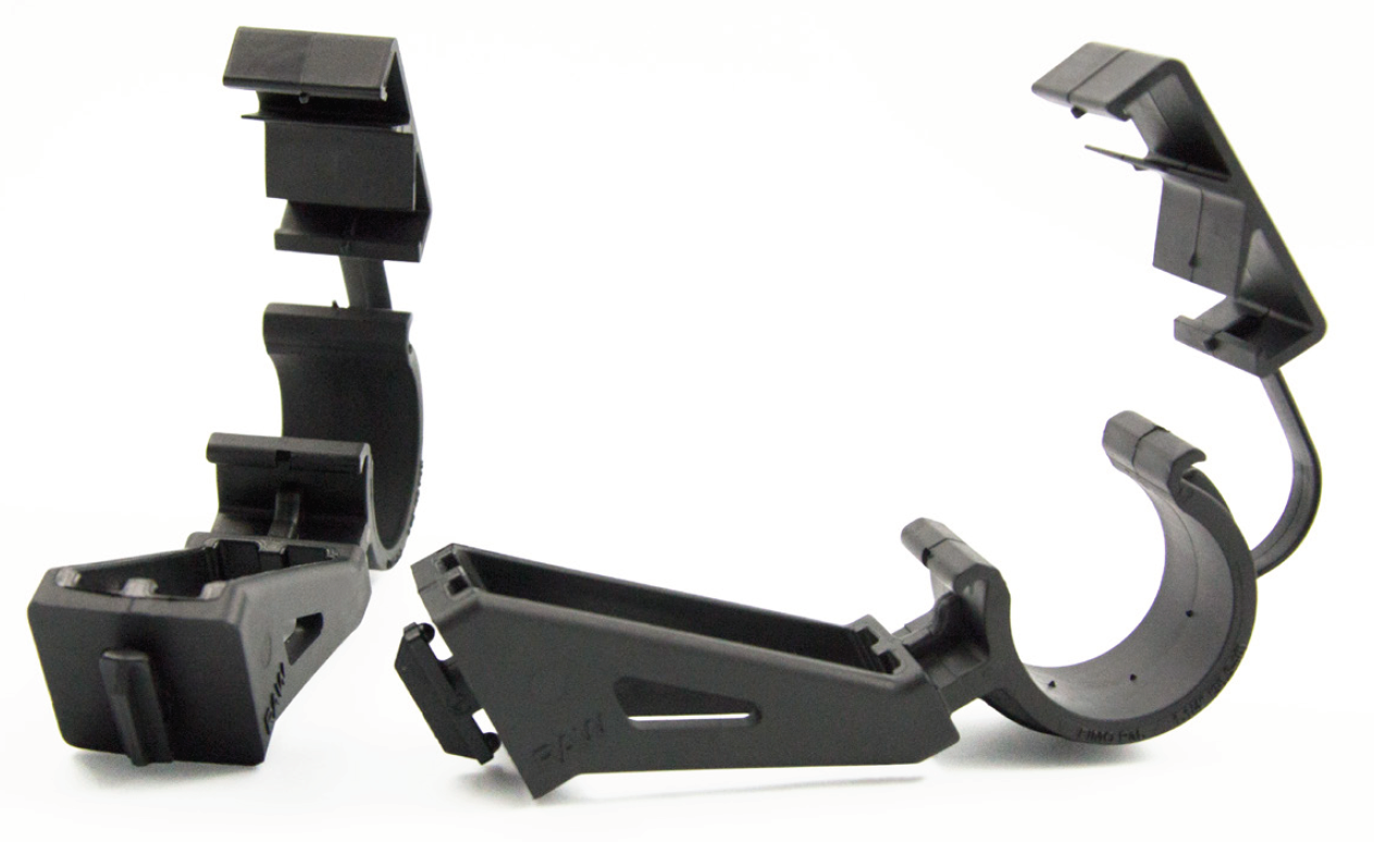 Three black plastic brackets in open position.