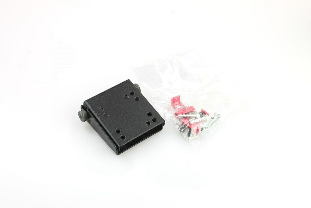 Black bracket next to plastic bag with screws and wall plugs.
