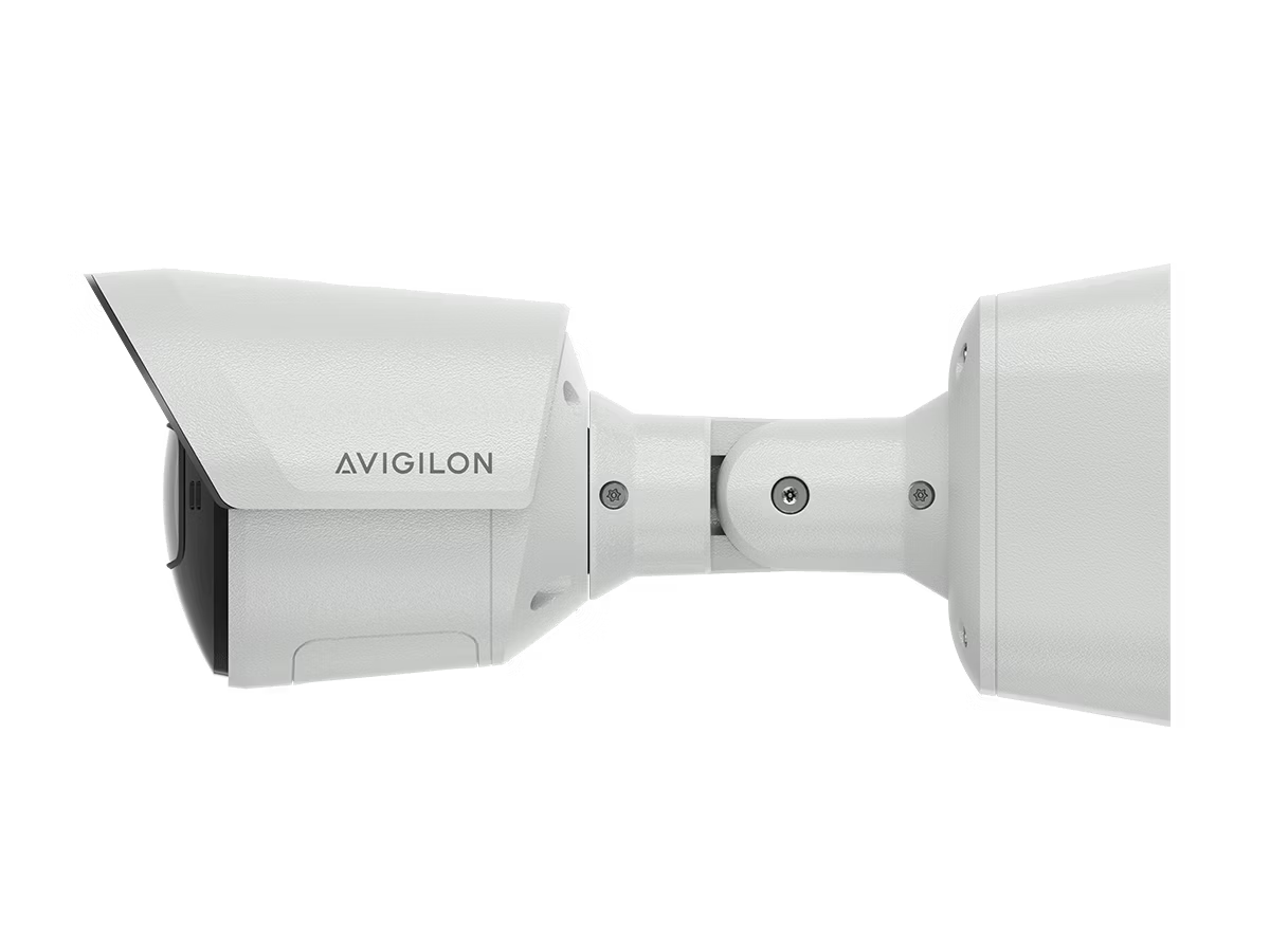 Surveillance camera side view, white casing.