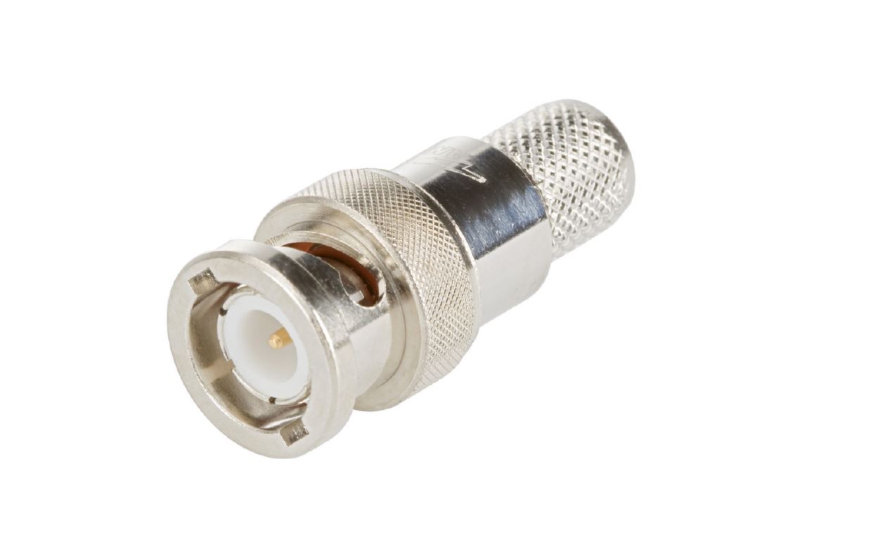 Silberner Metallstecker mit runder Öffnung und geriffelter Oberfläche.