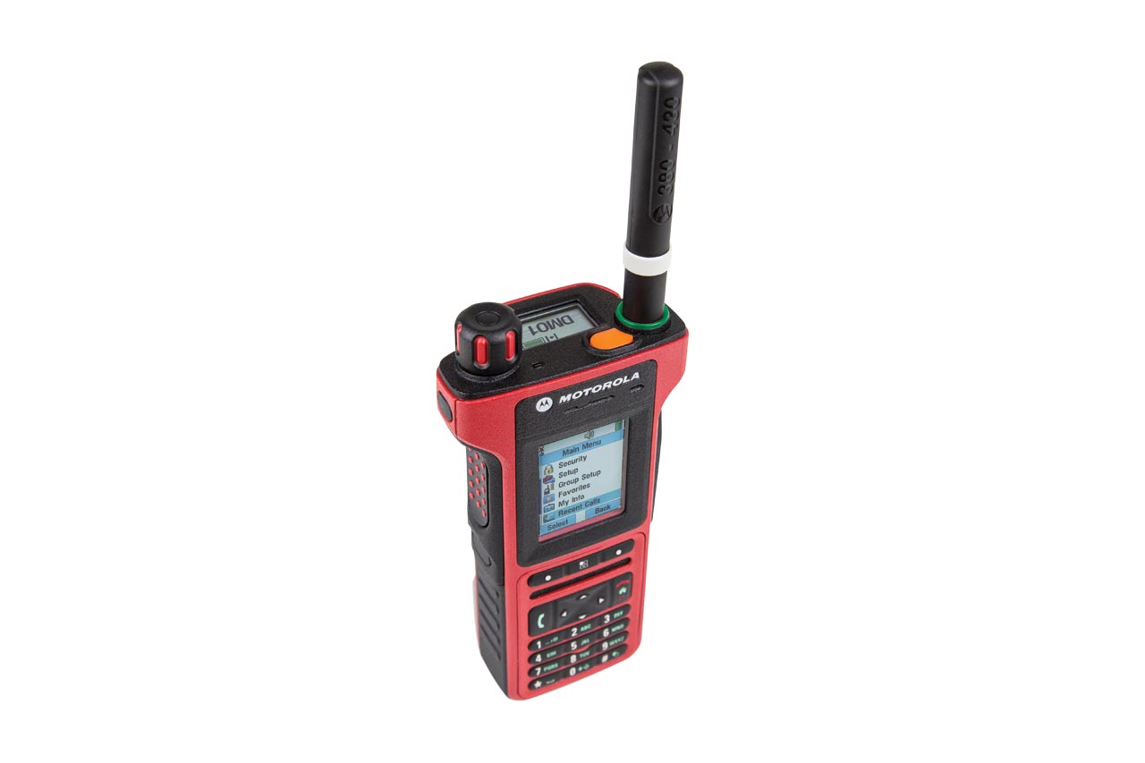 Handheld radio in red with display and keypad.