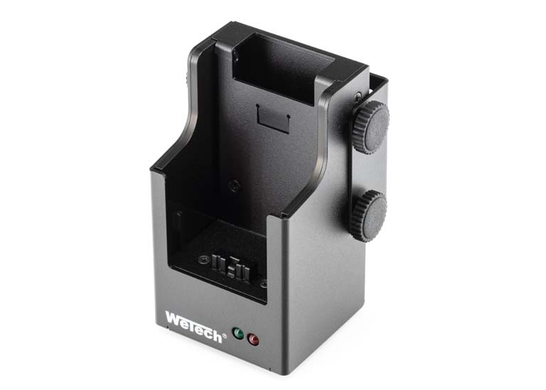 7000-00741400_wem_01kkqk5kkh2whcv.jpg Schwarze elektronische Halterung mit zwei seitlichen Knöpfen und LED-Anzeigen.