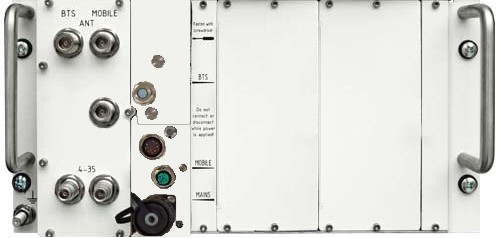Back of a technical device with connector sockets and handles.