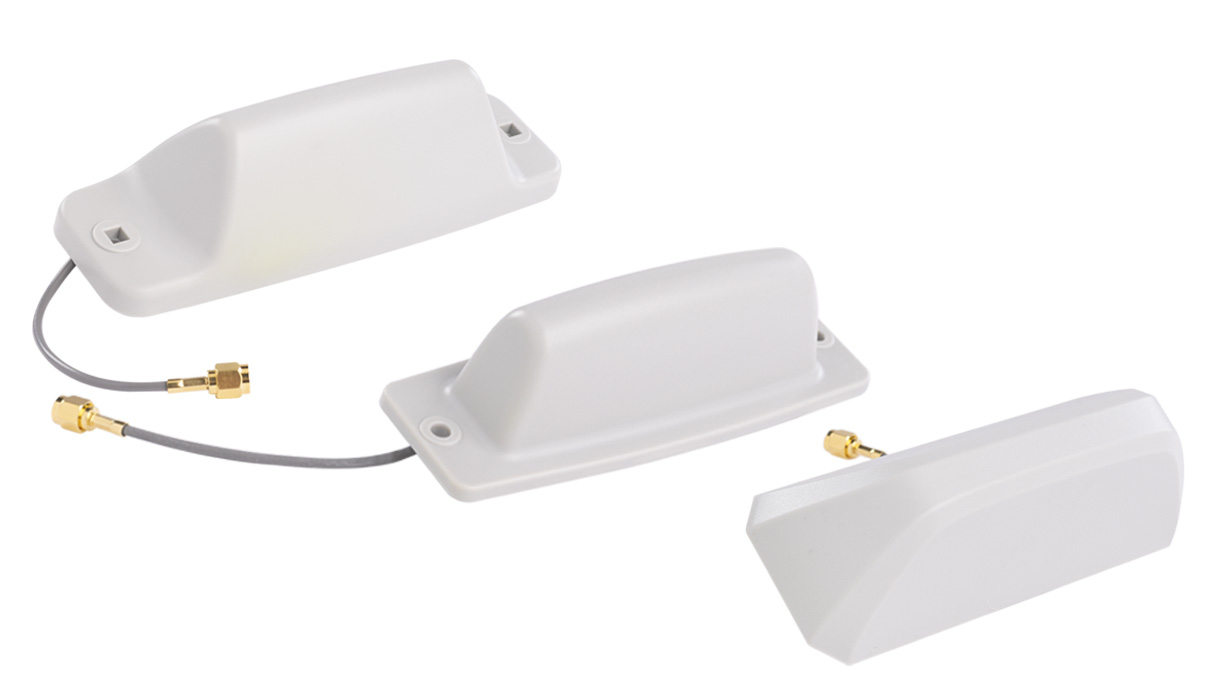 Three white antenna modules with cables and connectors.